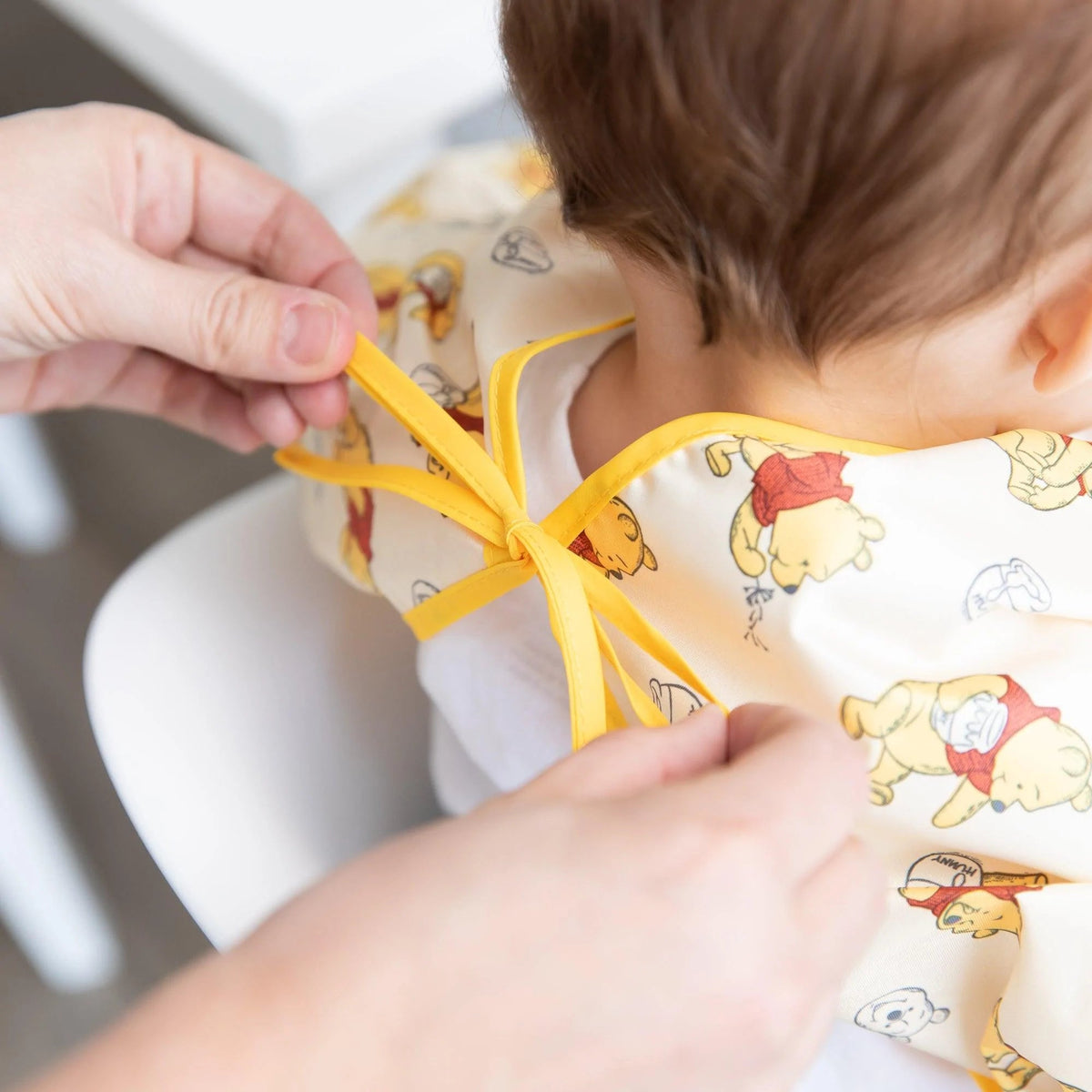 Winnie The Pooh Hunny Pot Sleeved Bib for Baby 6-24 mos | Bumkins
